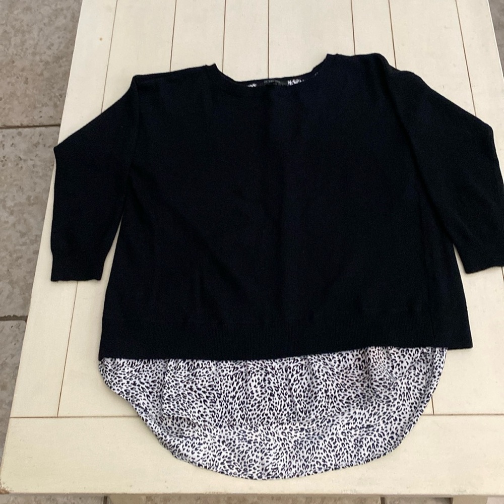 This really cute sweater with under blouse is in size XS. Sweater is black.